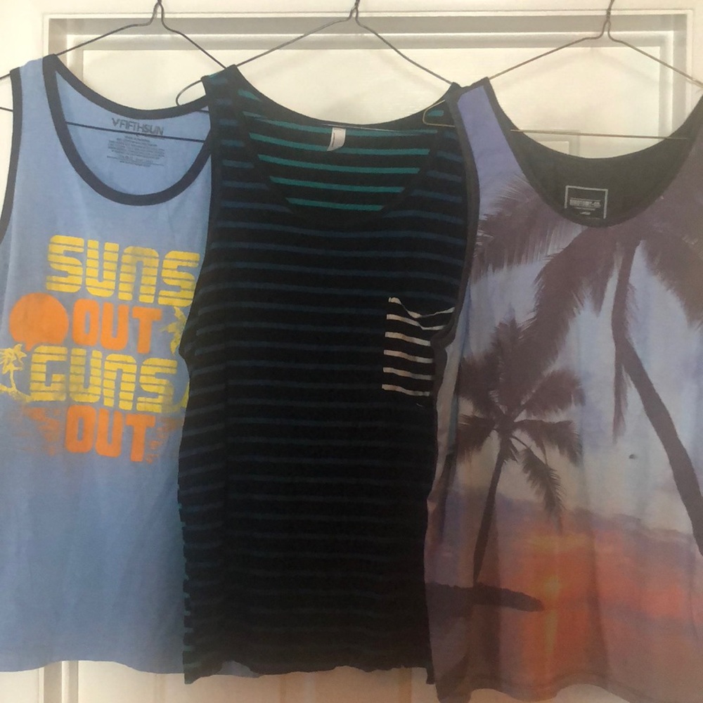 Group of 3 muscle T-shirts. Gently used